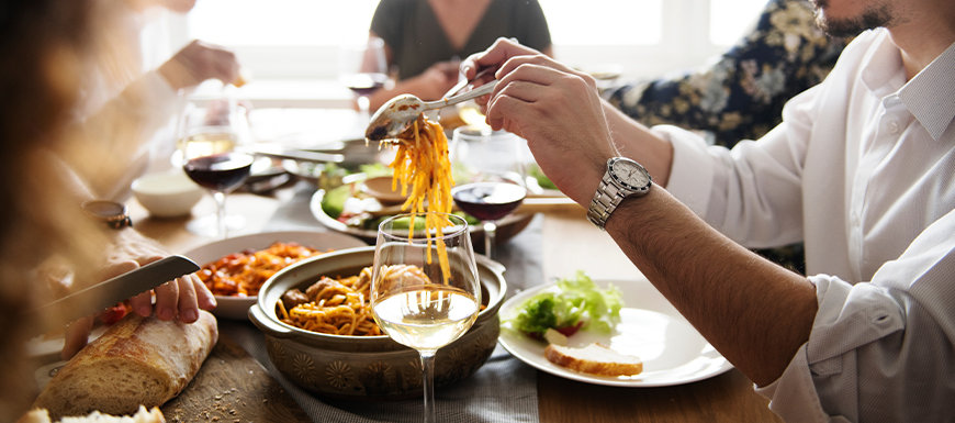 Family sharing an Italian dinner